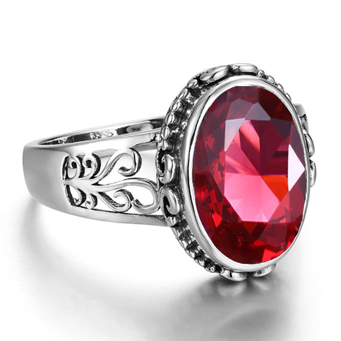 Chevalière pour femme argent pierre grenat côtés parementés