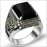 Chevalière homme en argent quatre crochés et les motifs royaux